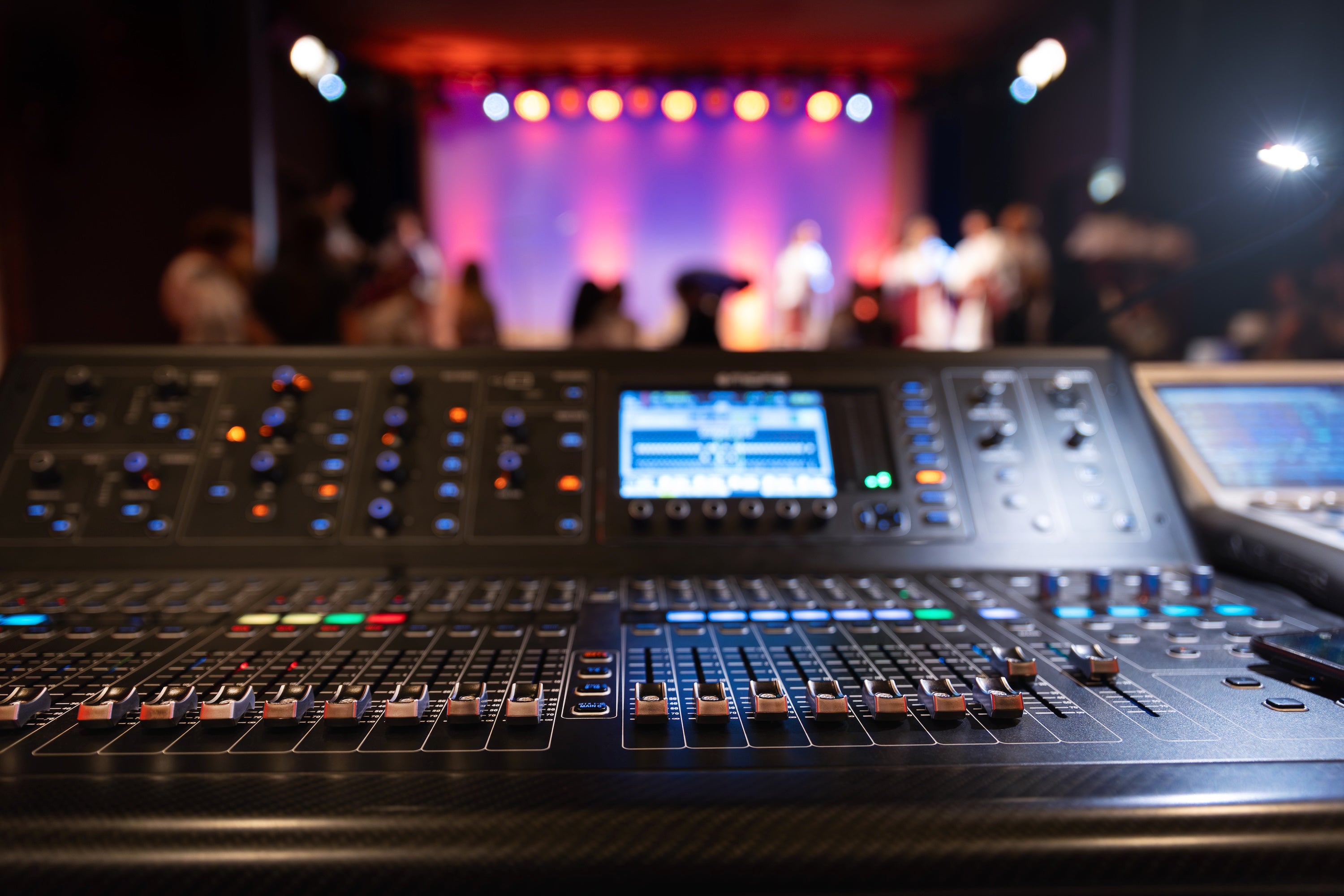 Front of the house view with mixing console and stage